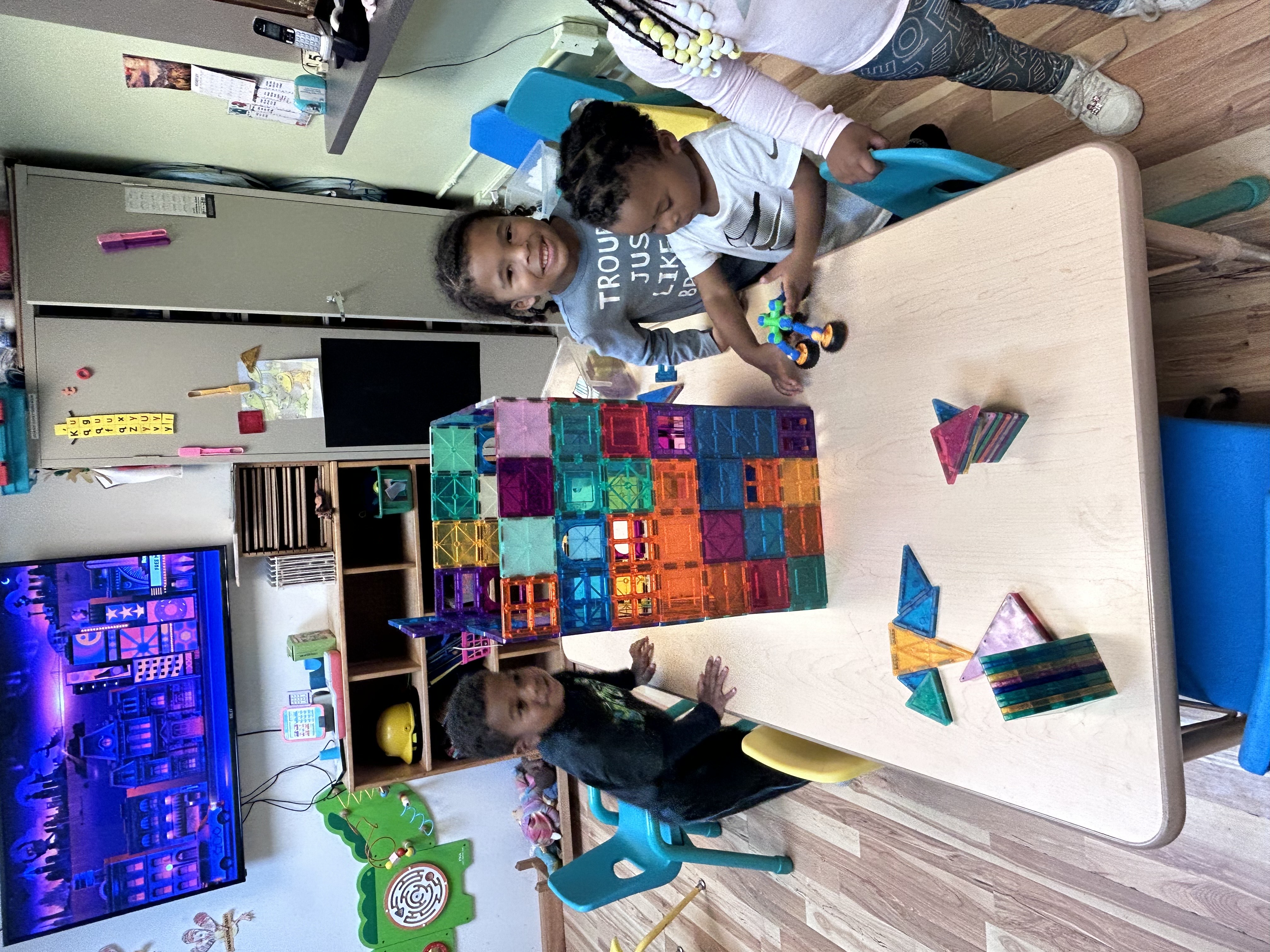 Child playing with magnet tiles